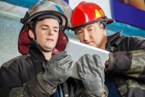 First responders looking at an iPad